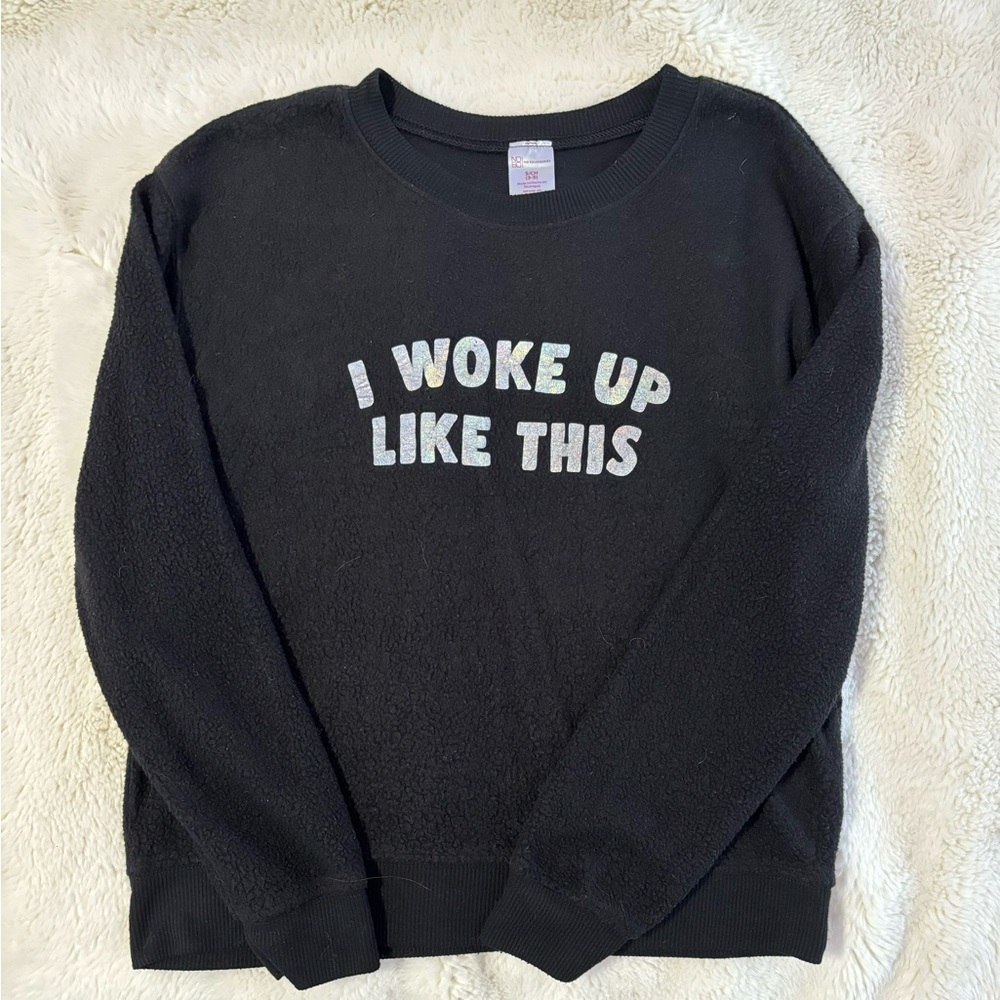very soft black crewneck with a reflective logo